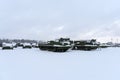 various military equipment in snow in winter