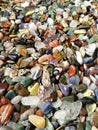 various minerals in the form of small multicolored pebbles Royalty Free Stock Photo