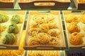 Various mix of uncooked pasta in on wooden tray in the shop window. Different kind of dry macaroni in round form. Italian foods Royalty Free Stock Photo