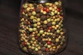 Various mixed peppercorns in a glass Royalty Free Stock Photo