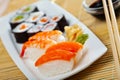 Various of nigiri and hosomaki sushi traditionally served with wasabi and soy sauce Royalty Free Stock Photo