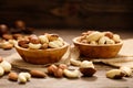 Various nuts in bowl - cashew, hazelnuts, almonds, brazilian nuts and macadamia on a wooden table.