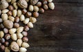 Various nuts placed on a wooden table