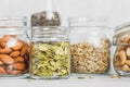 Various nuts and seeds in glass jars Royalty Free Stock Photo