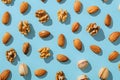 Various nuts showcased against an electric blue background