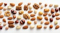 Various Nuts on white background, top view, copy space. Nuts assortment frame pecans, hazelnuts, walnuts, pistachios Royalty Free Stock Photo