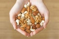 Various nuts in hands Royalty Free Stock Photo