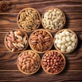 Various nuts in wooden bowls, top view. food background: pecan, hazelnut, walnuts, almonds, macadamia, cashew, brazil Royalty Free Stock Photo