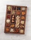 Various nuts in wooden box Royalty Free Stock Photo