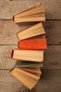 Various old books on wooden background, concept of knowledge, leisure time, university still life