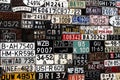 Various old car license plates from around the world at the muse Royalty Free Stock Photo