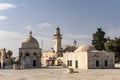 Various outbuildings, walls and minarets in the stone paved courtyard surrounding the Dome of The Rock Islamic Shrine in Jerusalem