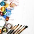 Various paint types and brushes displayed on the table Royalty Free Stock Photo