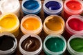 Various paints on the old wooden table . Creative concept