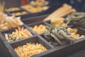 Various pasta in wooden box. Cooking concept. Top view Royalty Free Stock Photo