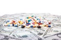 Various pharmaceuticals on dollar notes Royalty Free Stock Photo