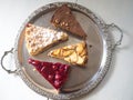 Various pieces of cake on a silver tray Royalty Free Stock Photo