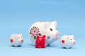 Various piggy-banks on azure background