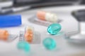 Various pills with other medical supplies Royalty Free Stock Photo