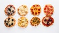 Various pizzas in a row, on a white background. Traditional Italian cuisine. AI generated.