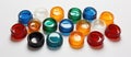 Various plastic bottle caps stacked on table, creating colorful circle art Royalty Free Stock Photo