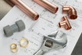 Various Plumbers Tools and Plumbing Materials on Architectural H Royalty Free Stock Photo