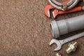 Various plumbing tools for connecting faucets and sewers with copy space, top view. Work background Royalty Free Stock Photo