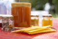 Various products such as propolis, honey wax plates against blurred background