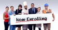 Various professional holding placard of now enrolling text