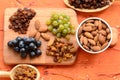 Various raisins, vine berries and almonds on chopping board Royalty Free Stock Photo