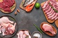 Various raw meat, fish and poultry. Dark rustic background. Assortment of fresh meats. Top view, flat lay. Royalty Free Stock Photo