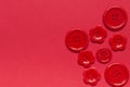 Various red sewing buttons on red background Royalty Free Stock Photo