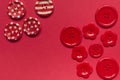 Various red sewing buttons on red background Royalty Free Stock Photo