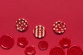 Various red sewing buttons on red background Royalty Free Stock Photo