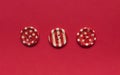 Various red sewing buttons on red background Royalty Free Stock Photo