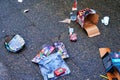 Various remains of a New Year`s Eve celebration on the sidewalk of a street