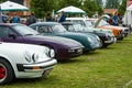 Various retro cars standing in a row in the exhibition field