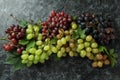 Various ripe grape on black smokey background Royalty Free Stock Photo