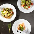 Various Salad on Black Stone Background Royalty Free Stock Photo