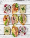 Various sandwiches: Prosciutto tapas, herring smorrebrods, sausage sandwiches