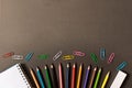 Various school supplies on the blackboard background . The concept of education. With empty space for text Royalty Free Stock Photo