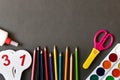 Various school supplies on the blackboard background . The concept of education. With empty space for text Royalty Free Stock Photo