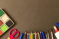 Various school supplies on the blackboard background . The concept of education. With empty space for text Royalty Free Stock Photo