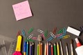 Various school supplies on the blackboard background . The concept of education. With empty space for text Royalty Free Stock Photo