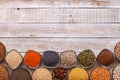 Various seeds and grains in bowls on old wooden table - with cop