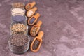 Various seeds - sesame, flax, poppy, hemp, chia and dill bowls on a gray background. Copy spacÃÂµ. Royalty Free Stock Photo