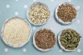 Various seeds in shiny bowls