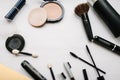 Various set makeup products: brushes, eyeshadow, powder, mascara, cosmetics isolated on light white background. Royalty Free Stock Photo