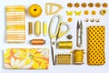 Various sewing accessories and tools yellow shades