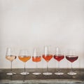 Various shades of Rose wine in stemmed glasses, square crop